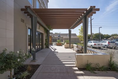 Covered outdoor seating area with plants