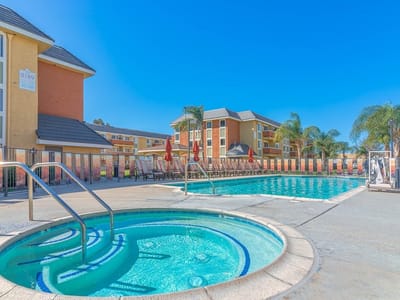 A beautiful outdoor pool area at The Orchards Apartments