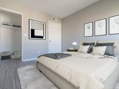 Cozy bedroom setup with neutral tones and artwork