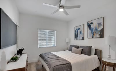 Modern bedroom with artwork and a bed