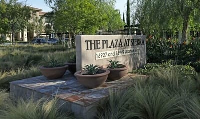 Exterior sign featuring the facility name and address