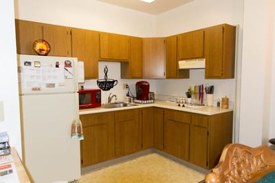 Bright kitchen area with appliances and decor