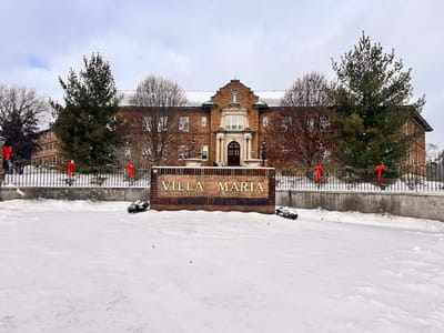 Exterior view of Villa Maria Retirement Community covered in snow