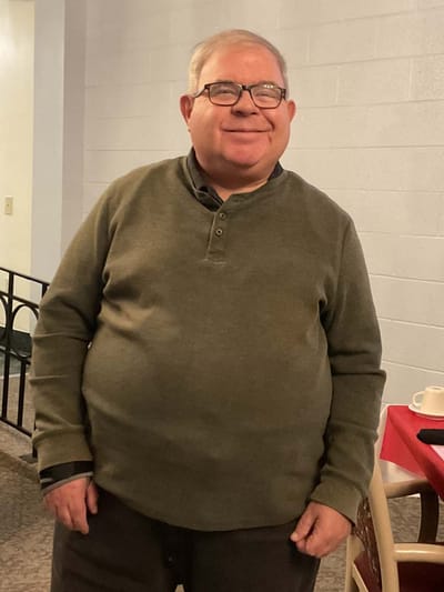 Resident standing in a common area of the facility