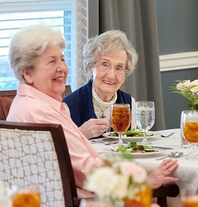 Residents enjoying a meal in the dining room