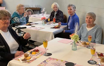 Residents enjoying a meal in the dining room