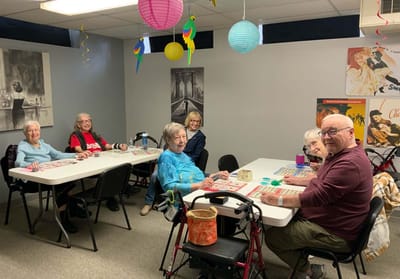 Residents enjoying a bingo game in an activity room