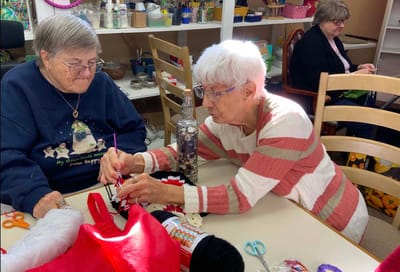Residents engaged in a crafting activity together