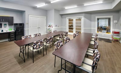 Bright common area with tables and chairs