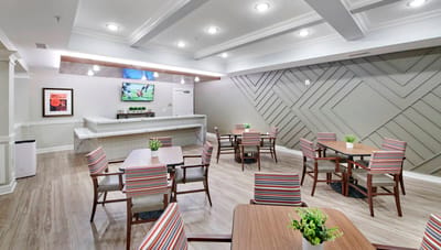 Bright dining area with tables and chairs