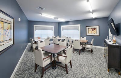 Interior view of a common area with tables and chairs
