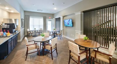 Cozy common area with tables and a television