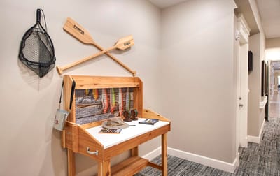 Decorative display in a hallway with fishing gear