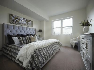 Bright, well-decorated resident bedroom with natural light