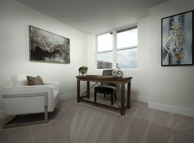 Cozy office space with modern decor and large windows