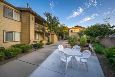 Outdoor seating area with garden beds