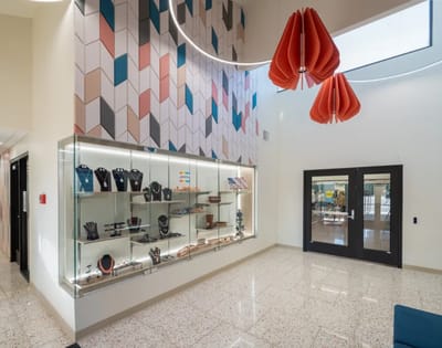 Bright interior showcasing artwork and display case