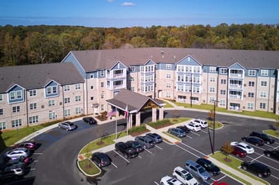 Aerial view of a nursing home facility with parking lot