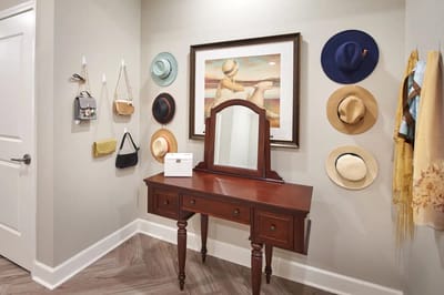 Decorative entryway with hats and wall art