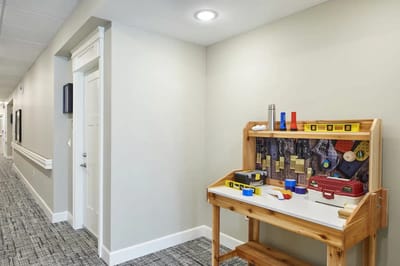 Activity table with tools in a hallway