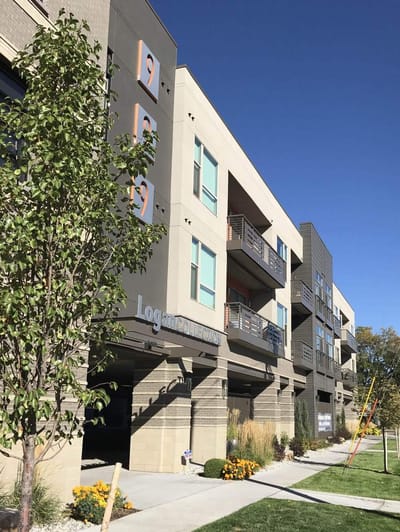 Exterior view of a senior living facility with landscaping