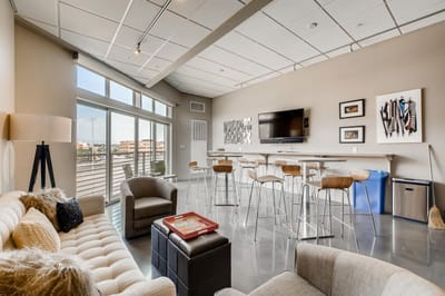 Bright common area with furniture and television