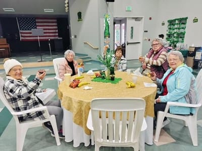 Residents enjoying a gathering around a table