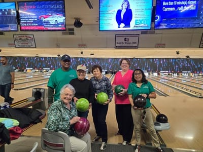 Residents enjoying a bowling activity together