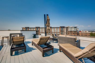 Outdoor lounge area with seating and umbrellas