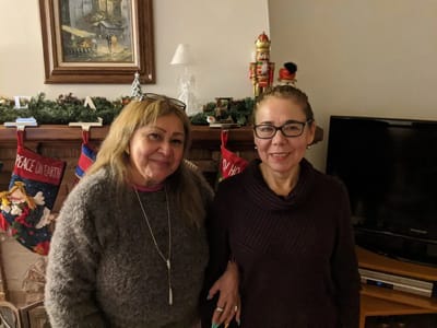 Residents smiling together in a cozy interior setting