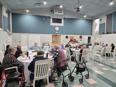 Residents enjoying a meal in a dining area