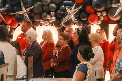 Residents and staff at a celebration event indoors