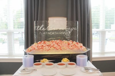 Ice sculpture featuring seafood at a dining event