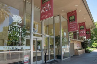 Exterior view of Park Place Apartments with signage