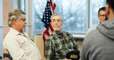 Residents engaged in conversation in a communal area