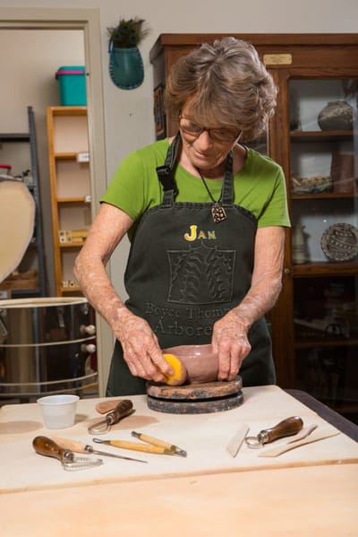 Resident crafting pottery in an art studio