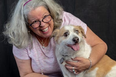 Resident enjoying time with a dog