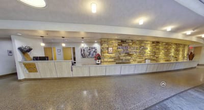 Reception area of a healthcare facility with stone wall decor