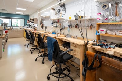 Interior of a craft workshop with wooden tables and tools