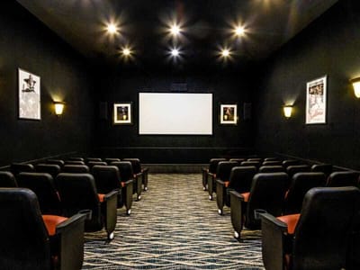 Interior view of a small theater room with seating