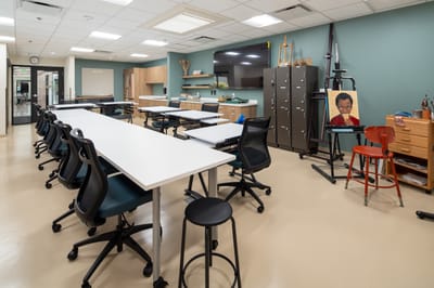 Interior view of an activity room with tables and chairs
