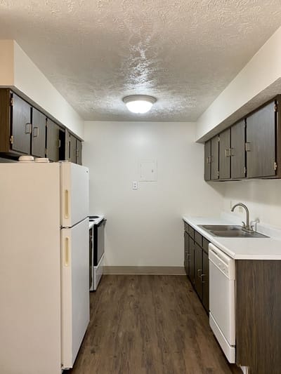 A well-lit, clean kitchen interior with appliances