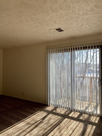 Bright interior room with sliding glass door