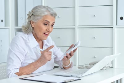 Resident engaged in a conversation using a smartphone