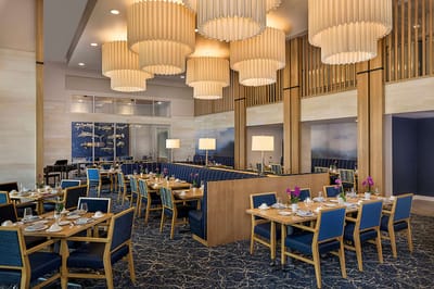 Elegant dining room with tables set for meals