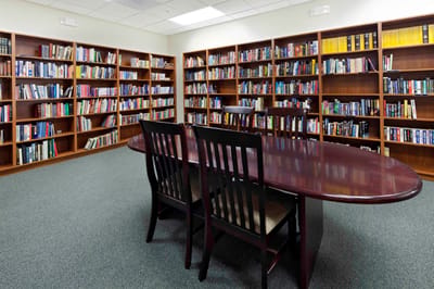 Interior view of a library with wooden bookshelves