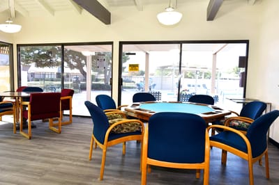 Bright common area with tables and chairs