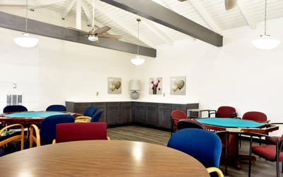 Interior view of a common area with tables and chairs