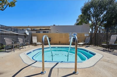 Outdoor hot tub surrounded by seating area