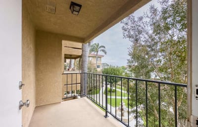 Balcony view looking over landscaped grounds